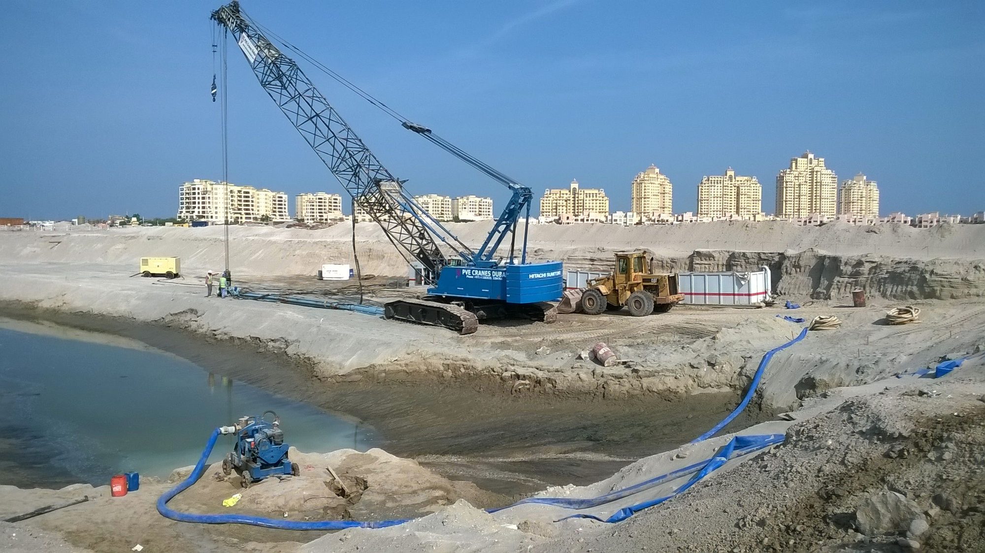 Crane-mounted vibro rig on a reclamation site